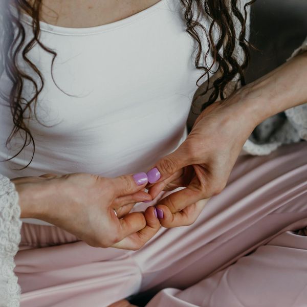 Person in a state of flow and concentration during a calm exercise routine.